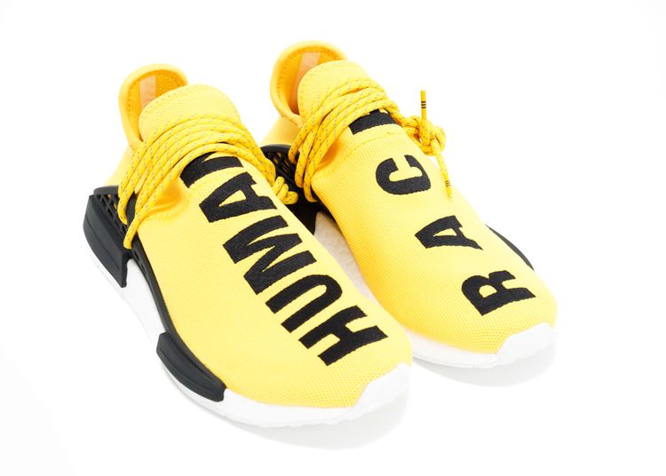yellow human race sneakers