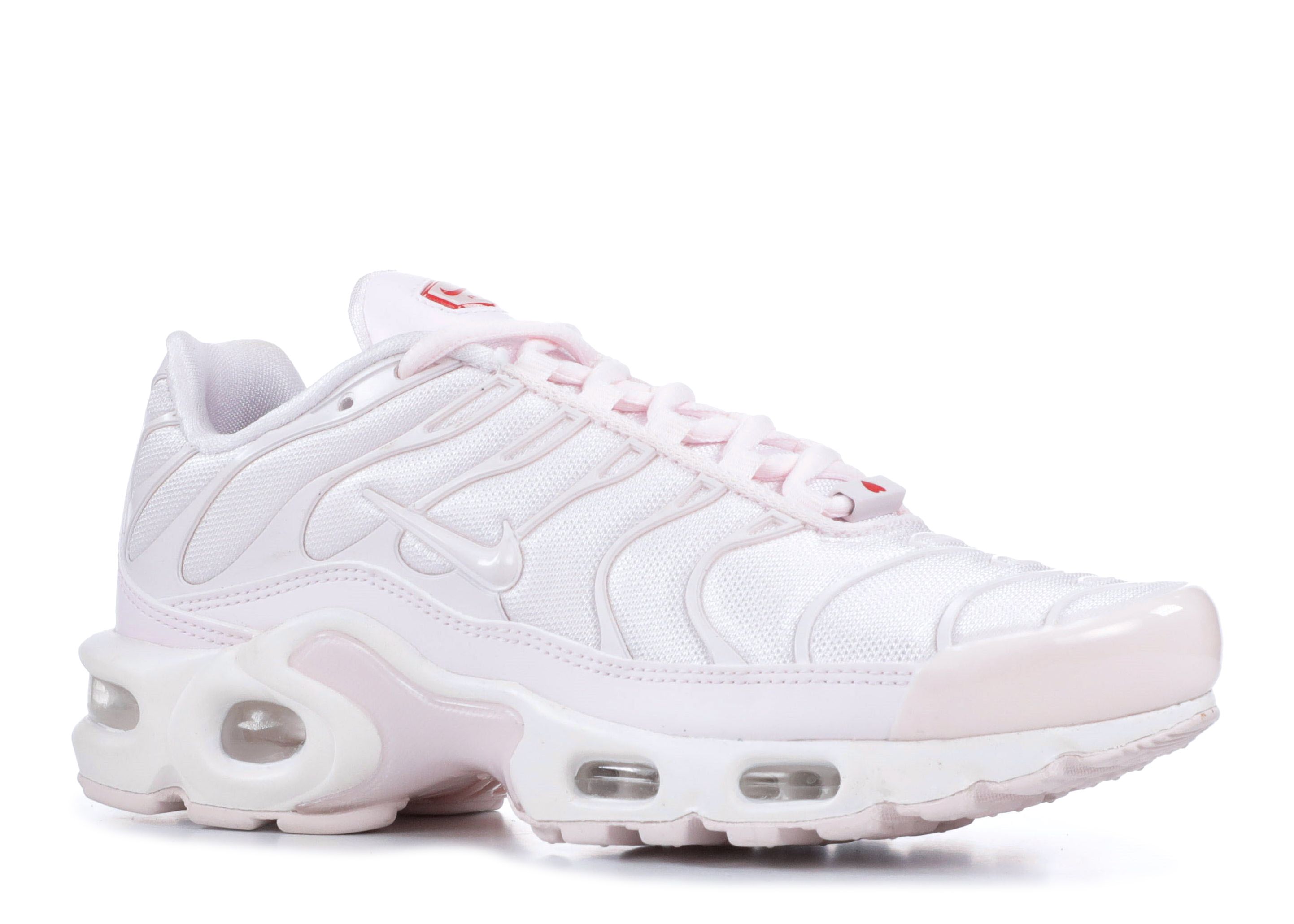 pink and white nike tns
