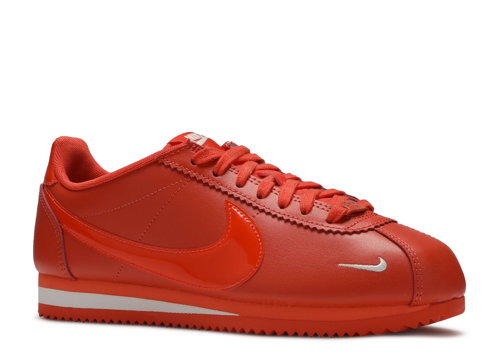 white and orange nike cortez