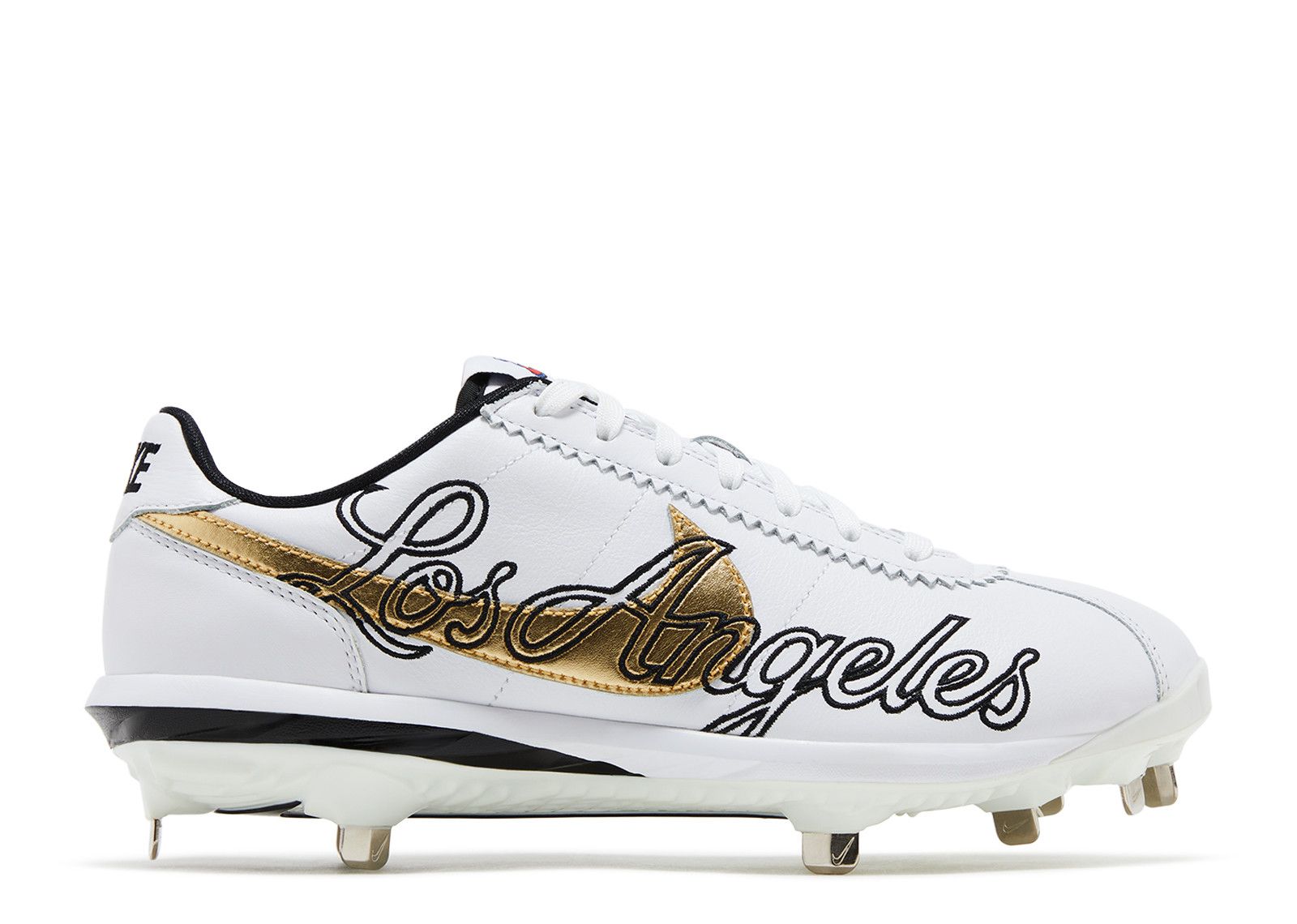 white and gold metal baseball cleats